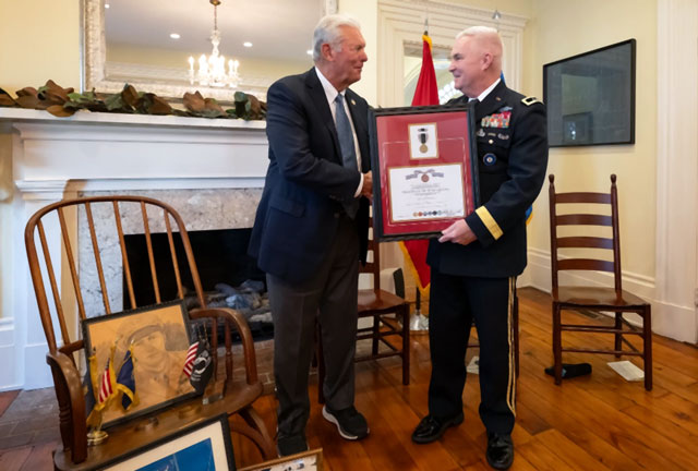 U.S. Army Maj. Gen. Haldane Lamberton, right, adjutant general of the Kentucky National Guard, presents a posthumous Prisoner of War Medal to Sterling P. Owen IV on behalf of Owen’s late uncle, U.S. Air Force Brig. Gen. Jack Henry Owen, during a ceremony in Cynthiana, Ky., Nov. 13, 2023. General Owen, who served in the Kentucky Air National Guard for more than 24 years, rising to become assistant adjutant general for Air, was piloting a B-17 Flying Fortress over Hamburg, Germany, on July 25, 1943, when the aircraft was shot down. He and his crewmen safely parachuted to the ground but were captured by German forces, and Owen remained a POW for the duration of World War II. (U.S. Air National Guard photo by Dale Greer)